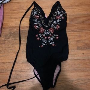 One piece black bathing suit open back